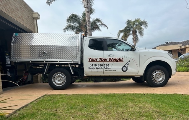 A 4WD towing a caravan on an open road